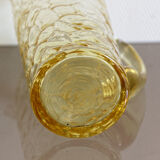 Pitcher in crumpled glass