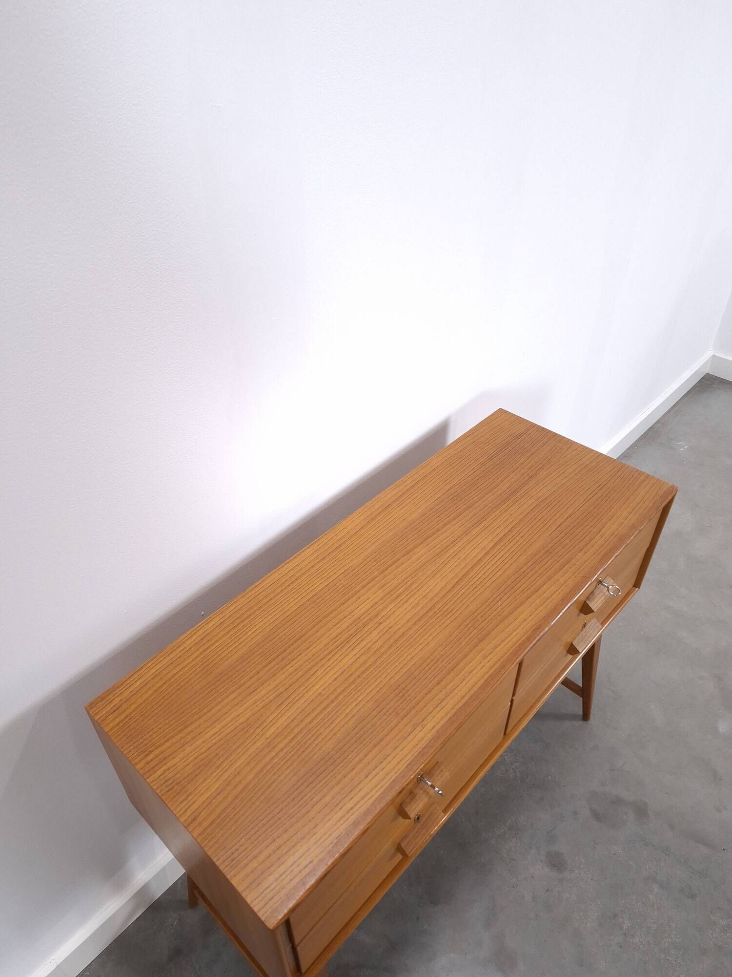 Vintage teak Danish chest of drawers with high slanted legs, side table, sideboard.
