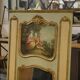 Trumeau mirror with cracked patina and oil on panel depicting a romantic scene from the 19th century.
