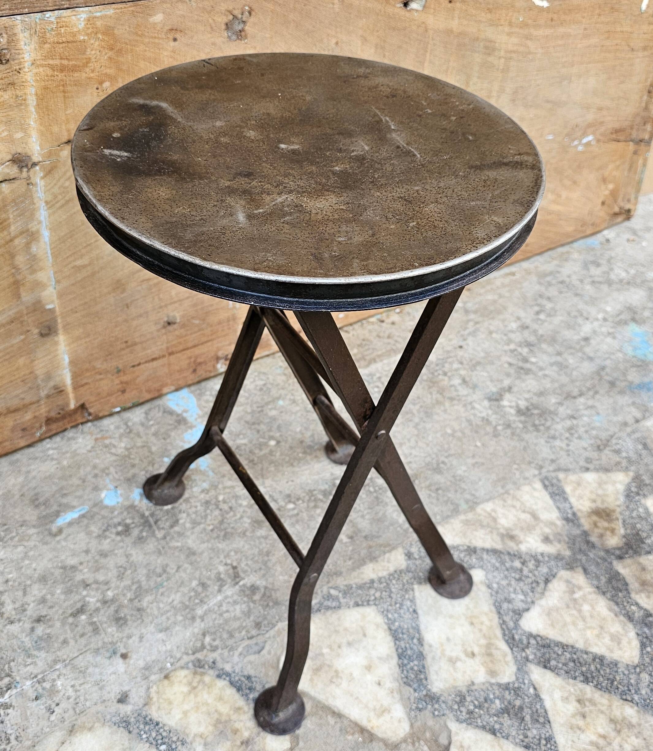 Old industrial folding steel stool