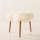 Scandinavian mid century triangular footstool in long hair sheepskin