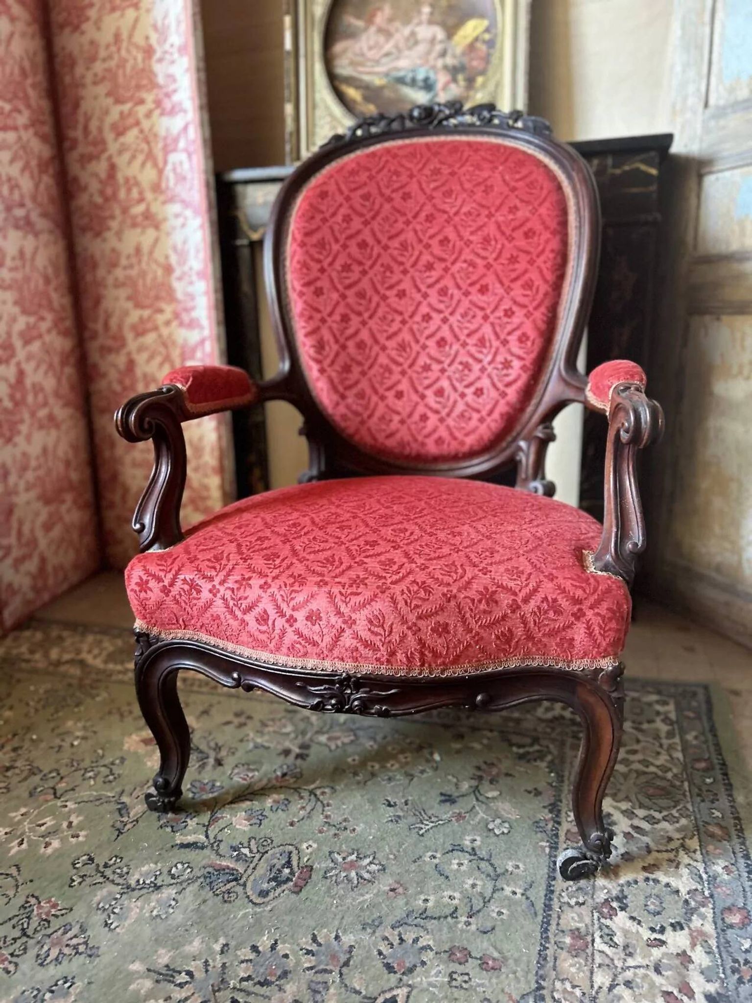 Napoleon III medallion armchair in carved wood and red velvet.
