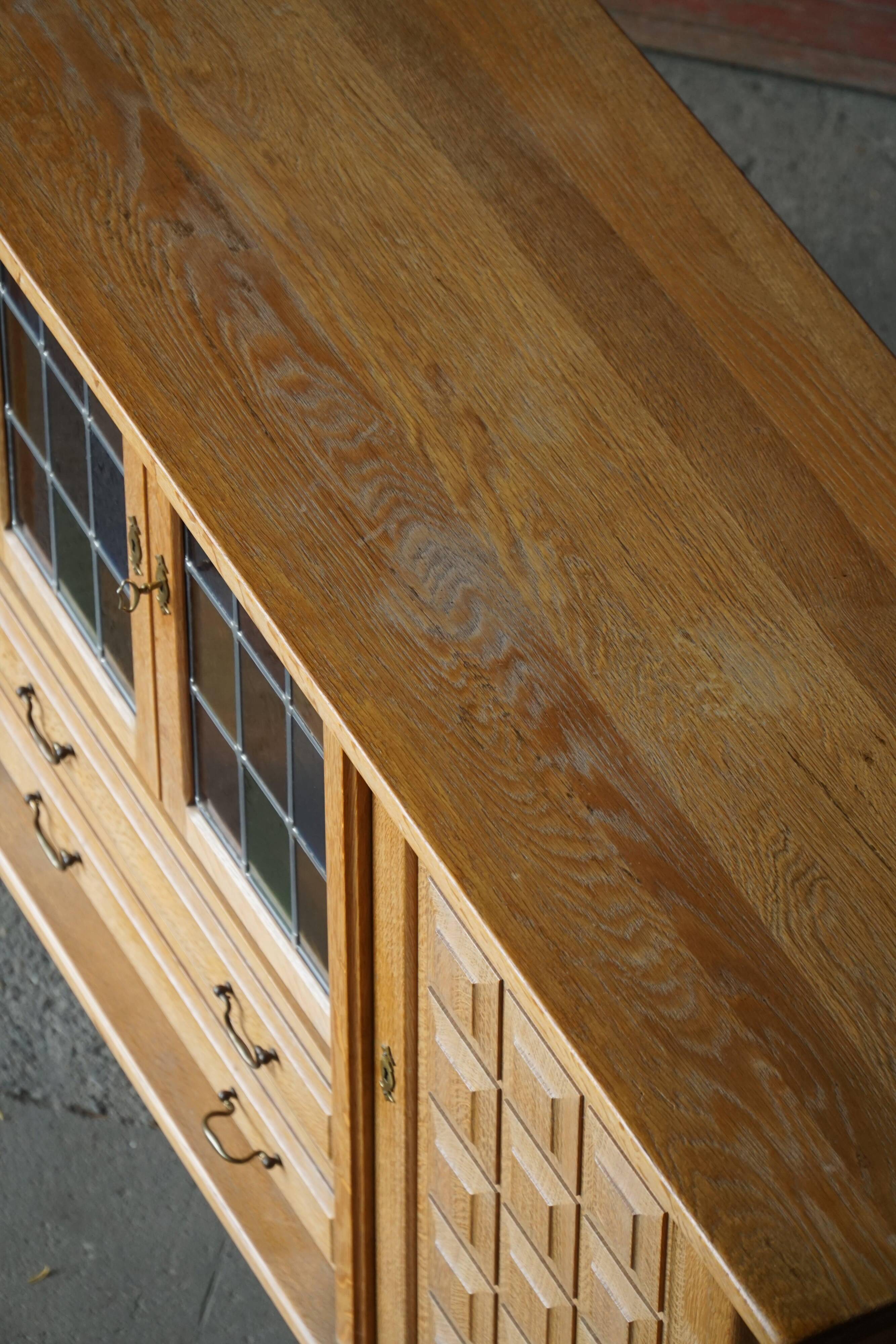 Danish oak buffet with lead glass doors, Henning Kjærnulf, Denmark, 1960s