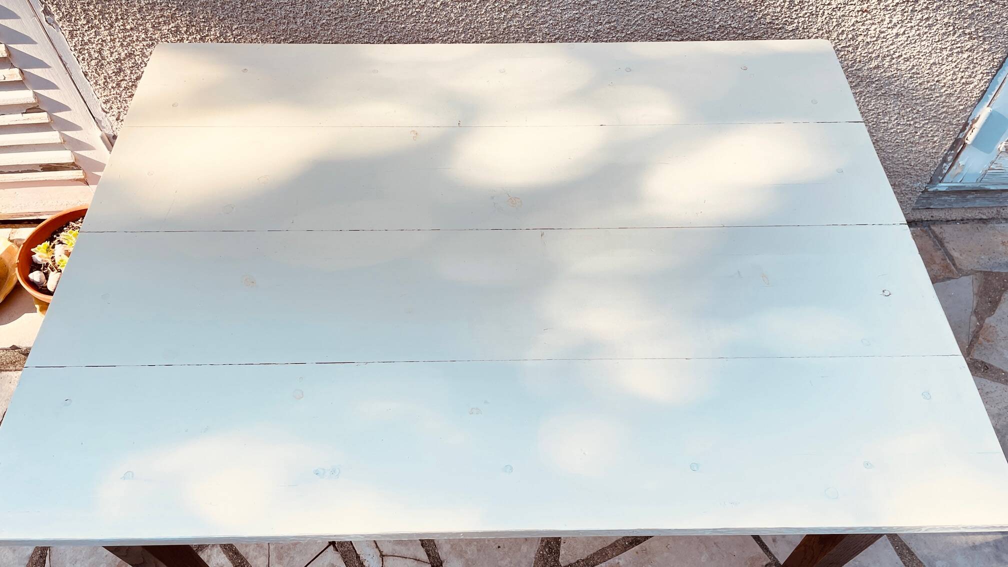 Vintage oak farmhouse table with a white top.