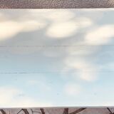 Vintage oak farmhouse table with a white top.