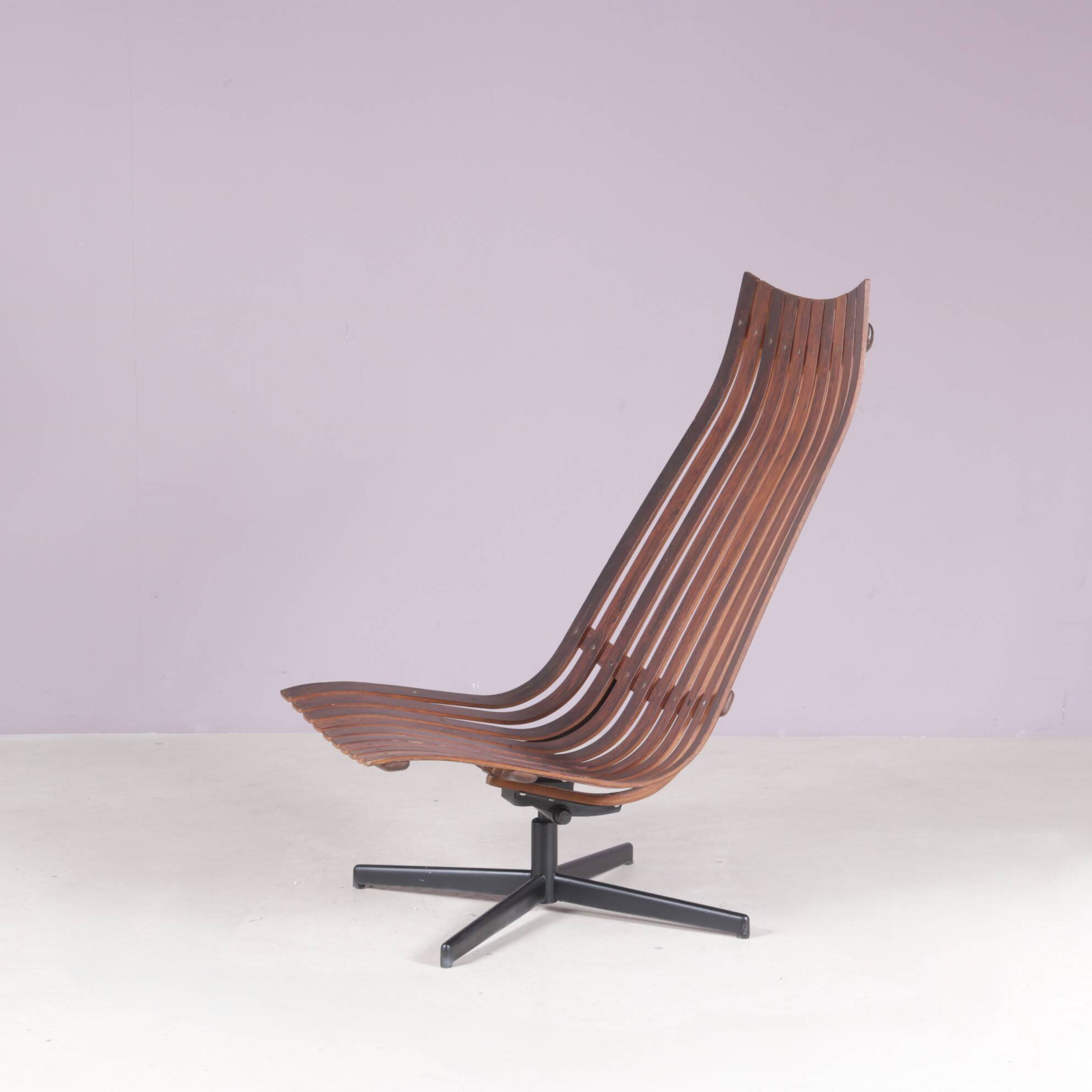 Lounge chair Rosewood with black metal cross base Hans Brattrud 1960s