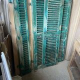 Old green shutter blinds