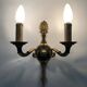 Pair of wall sconces in the Empire style with double lights in bronze.
