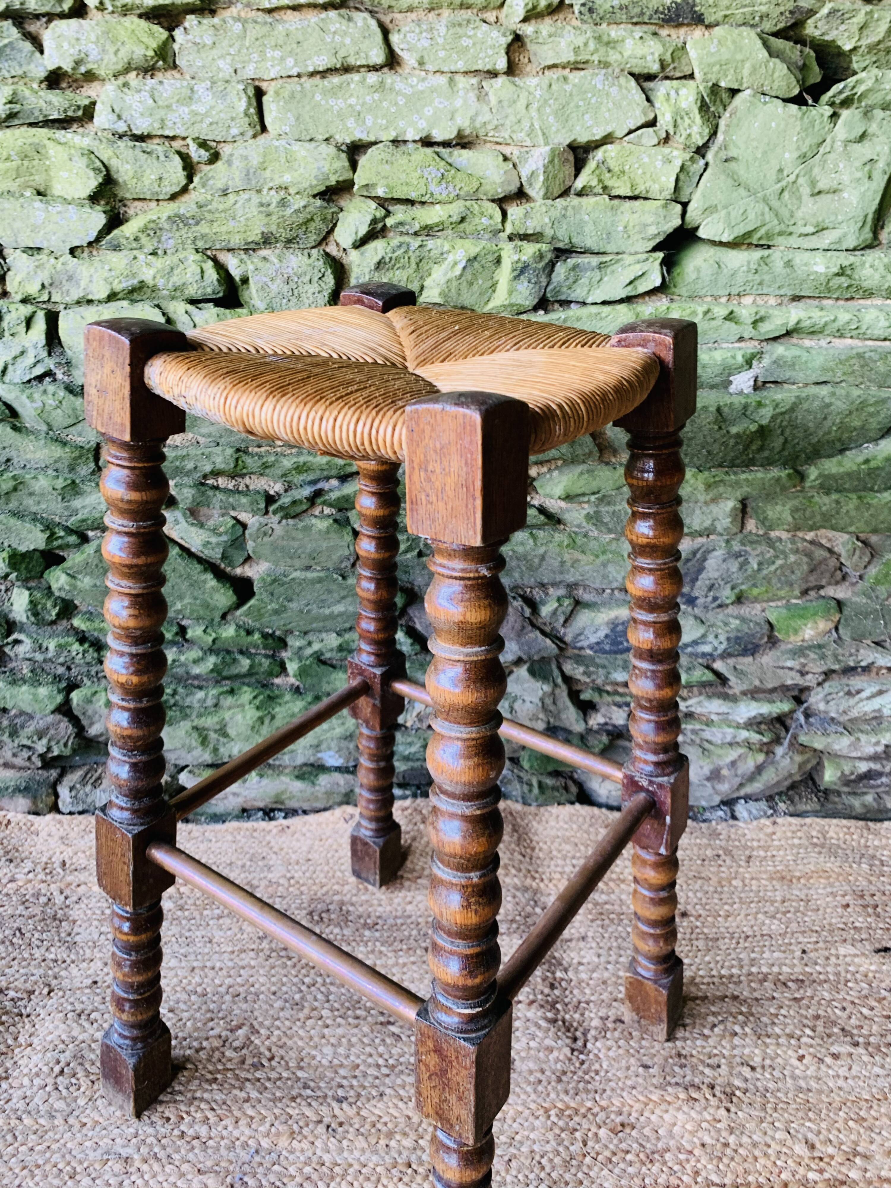 High stool in turned wood