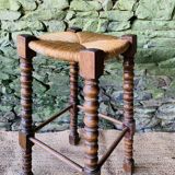 High stool in turned wood