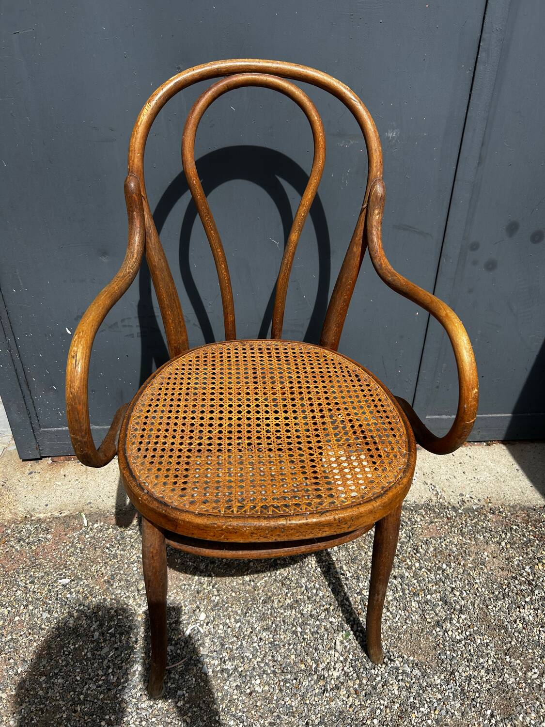 Fauteuil Thonet bois courbé et cannage – modèle bistrot