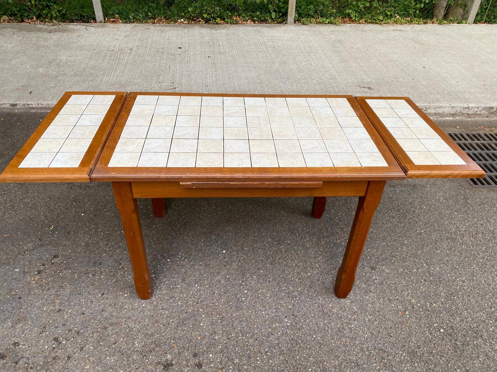 Dining table or farmhouse kitchen style with solid wood and tiles.