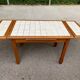 Dining table or farmhouse kitchen style with solid wood and tiles.