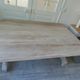 Console, solid walnut table, foldable extensions, grey patinated legs.