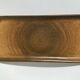 Speckled brown Longchamp sandstone cake dish