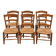 Set of six rustic chairs in natural wood with straw seats.