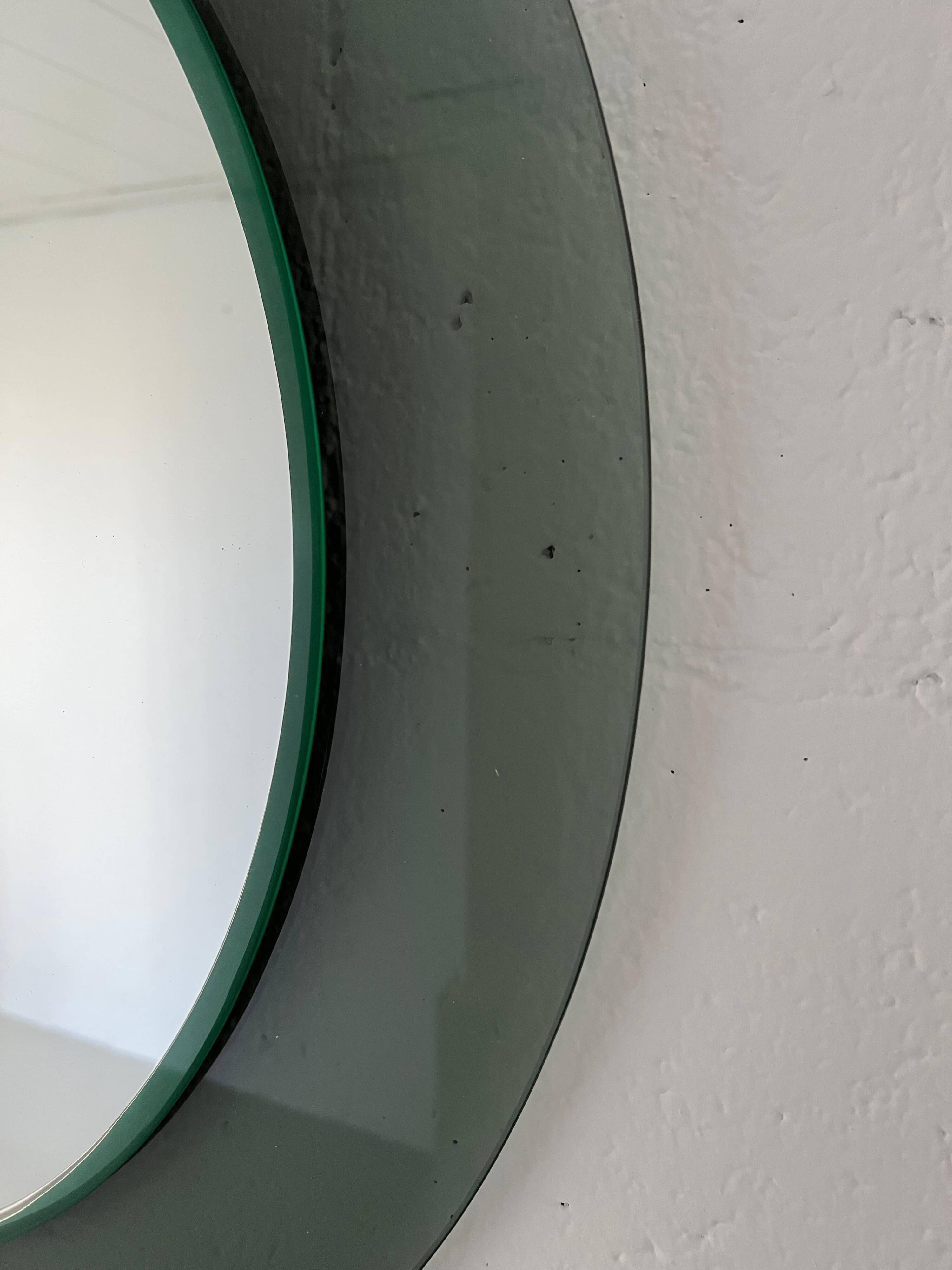 Decorative round wall mirror in smoked glass, Space Age Italian collectible