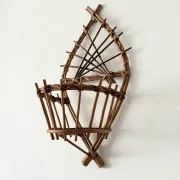 Wall-mounted plant holder in rattan