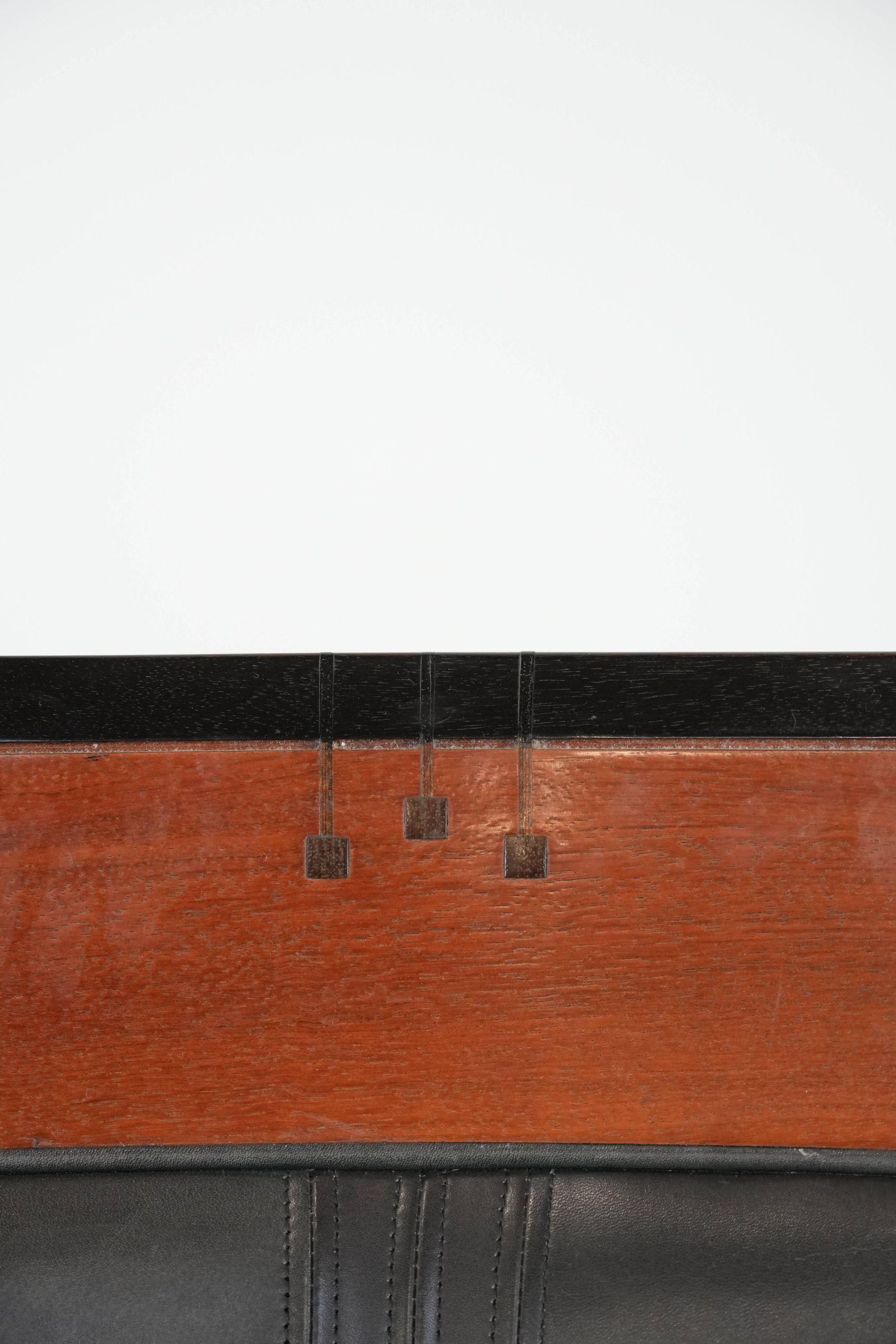 Black Art Deco cowhide leather and wooden design armchair with a high back