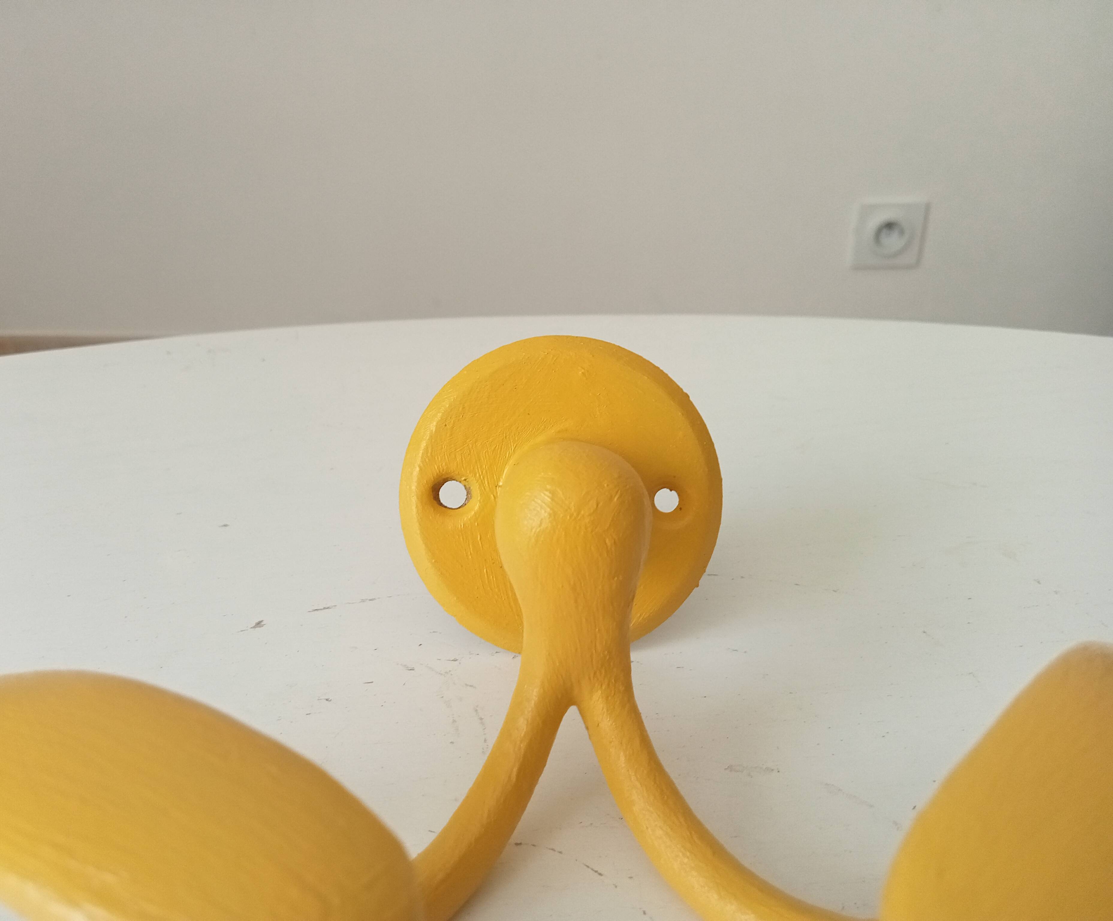 Vintage double coat rack in solid brass