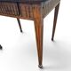 Antique game table in patinated wood in the Louis XVI style.