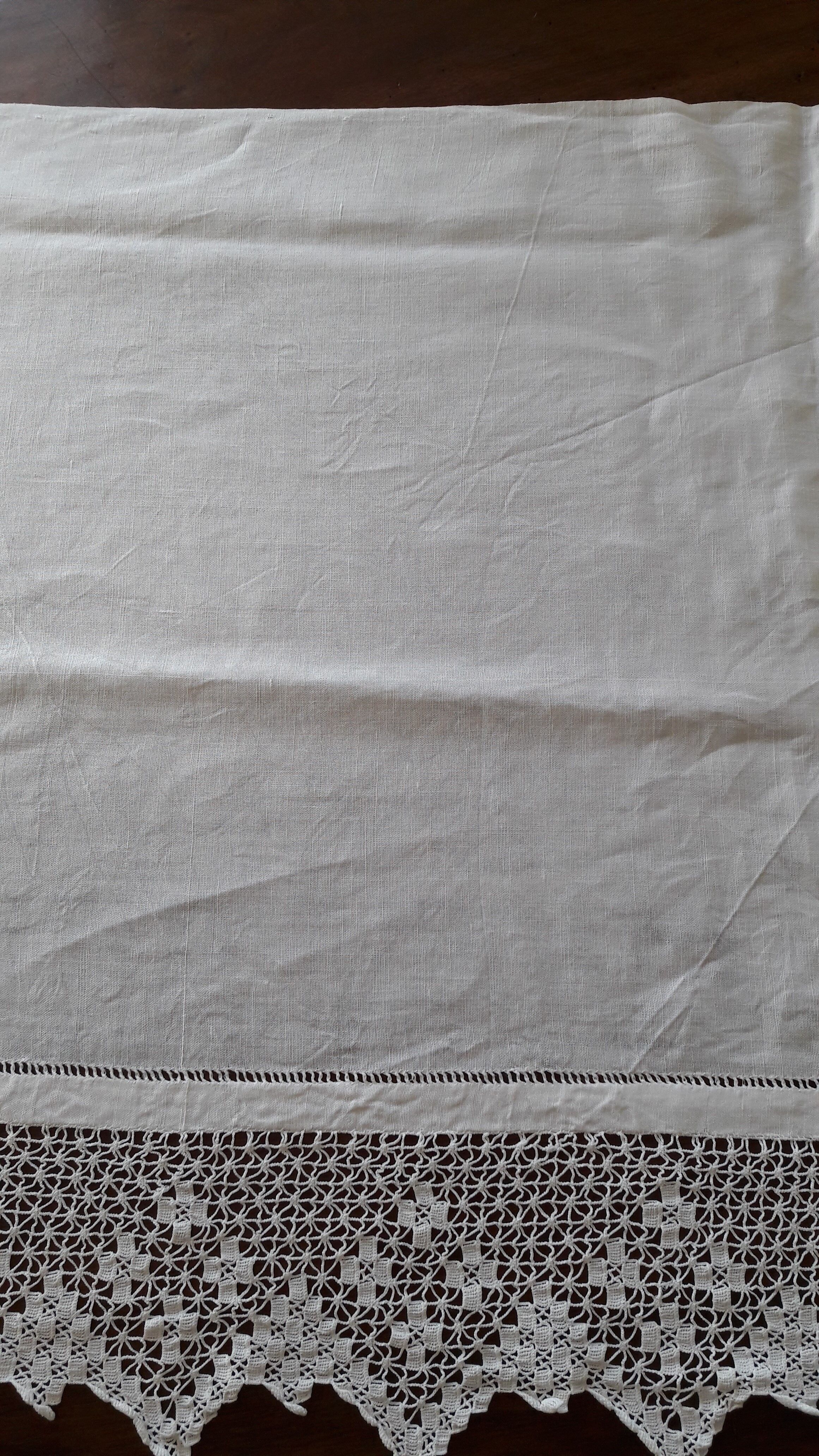 Old hotel tablecloth in white linen