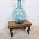 Antique footstool with rustic charm