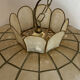 Large mother-of-pearl and brass chandelier with floral decoration.