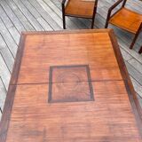 Rectangular dining table set and its suite of 6 armchairs in exotic wood and bamboo.