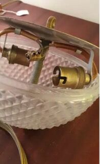 Pair of faceted glass ceiling lights and brass strapping, 1950.