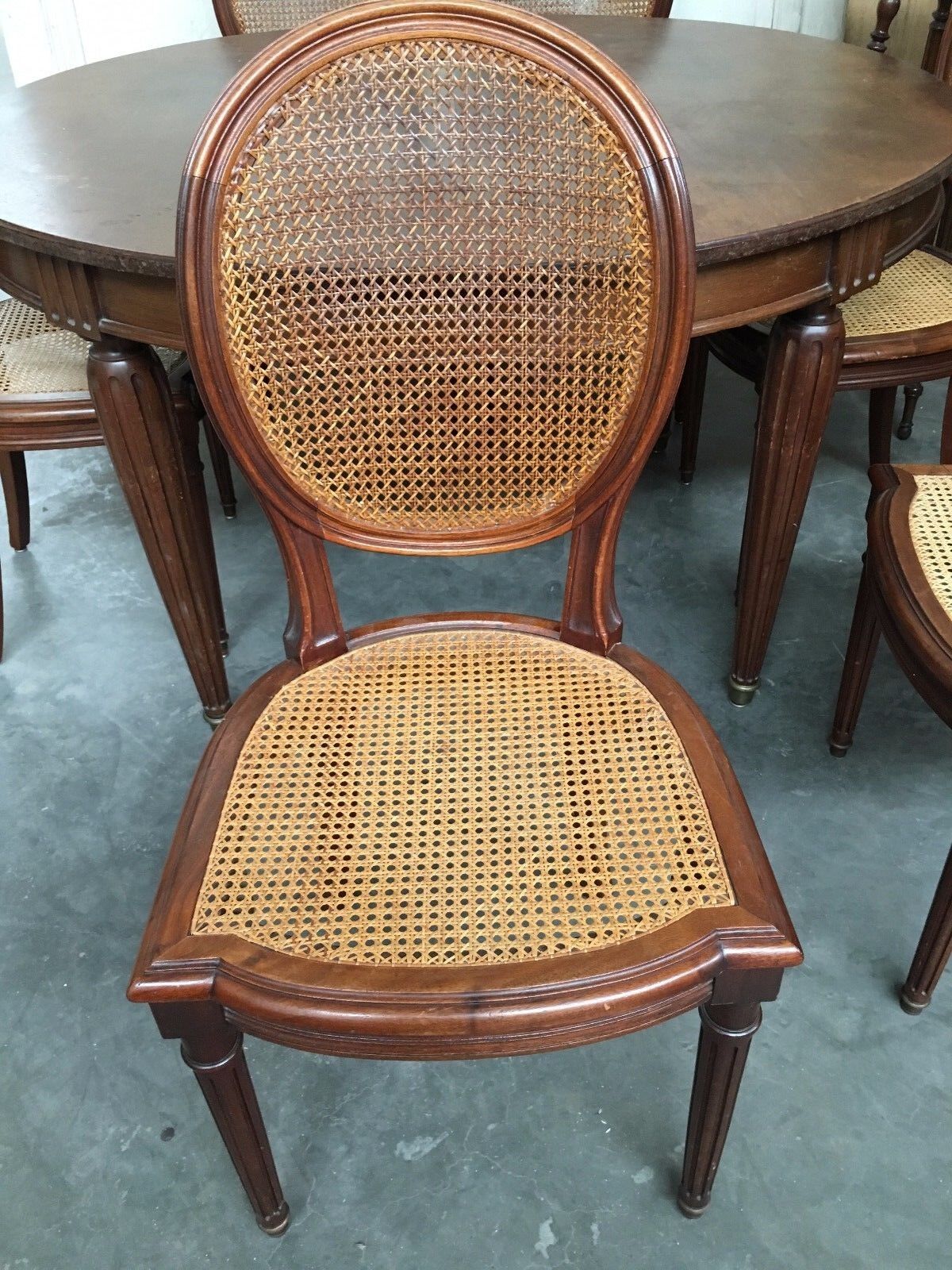 Table and six chairs in the Louis XVI style mahogany