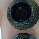 Black cups and saucers with relief decoration