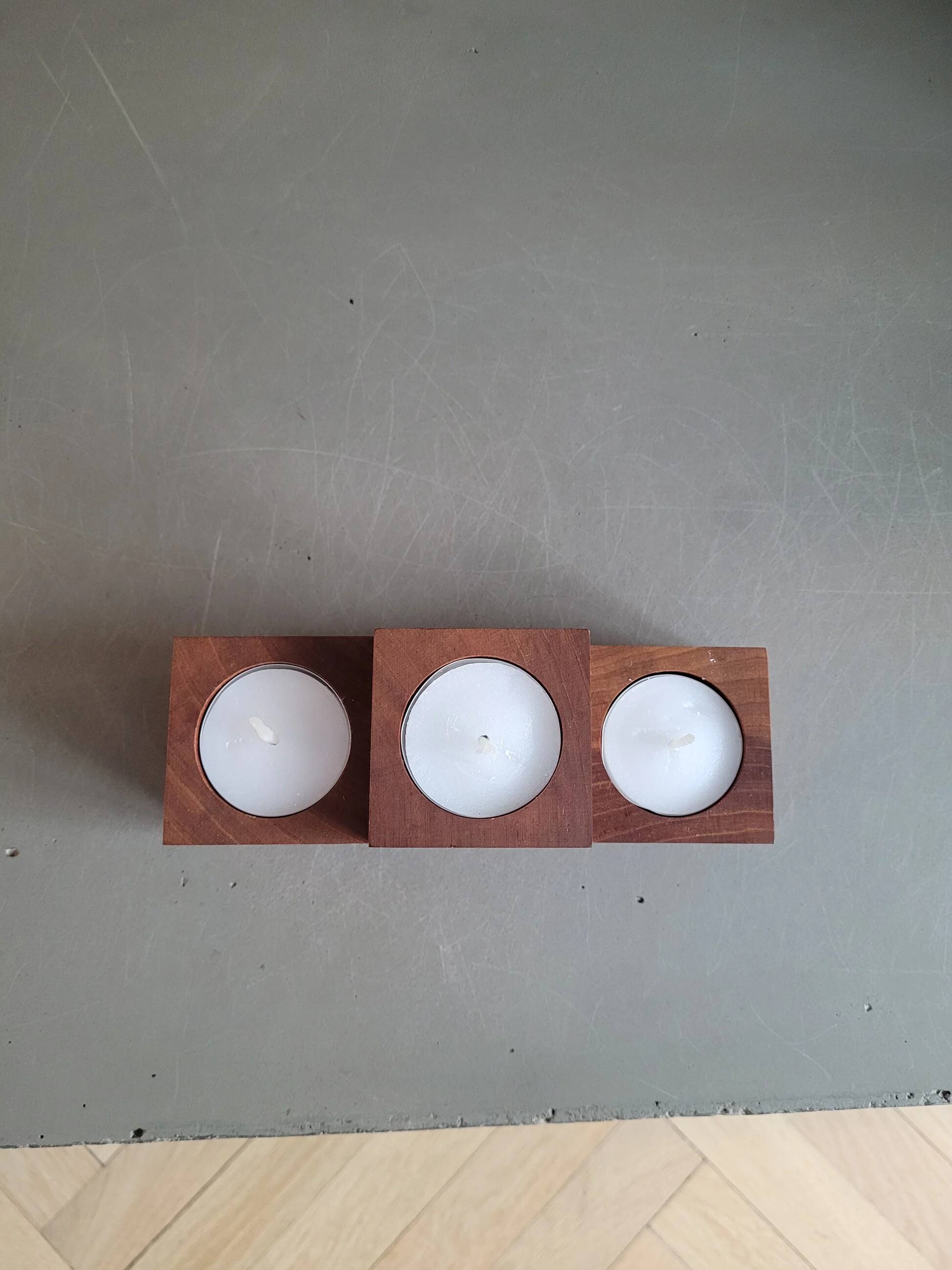 Vintage teak candlestick trio