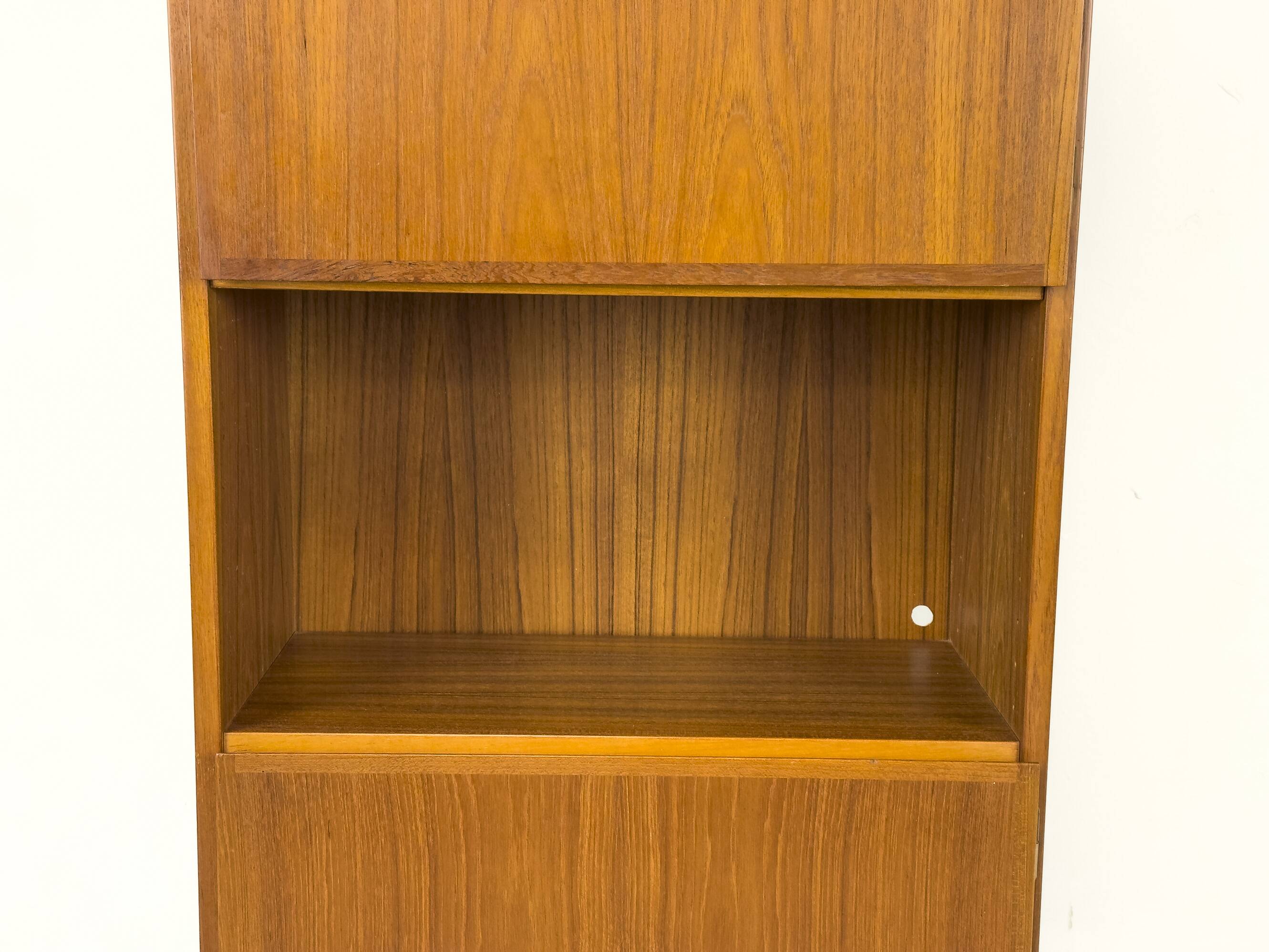 Narrow teak bookcase with two doors by Omann Jun, 1970s