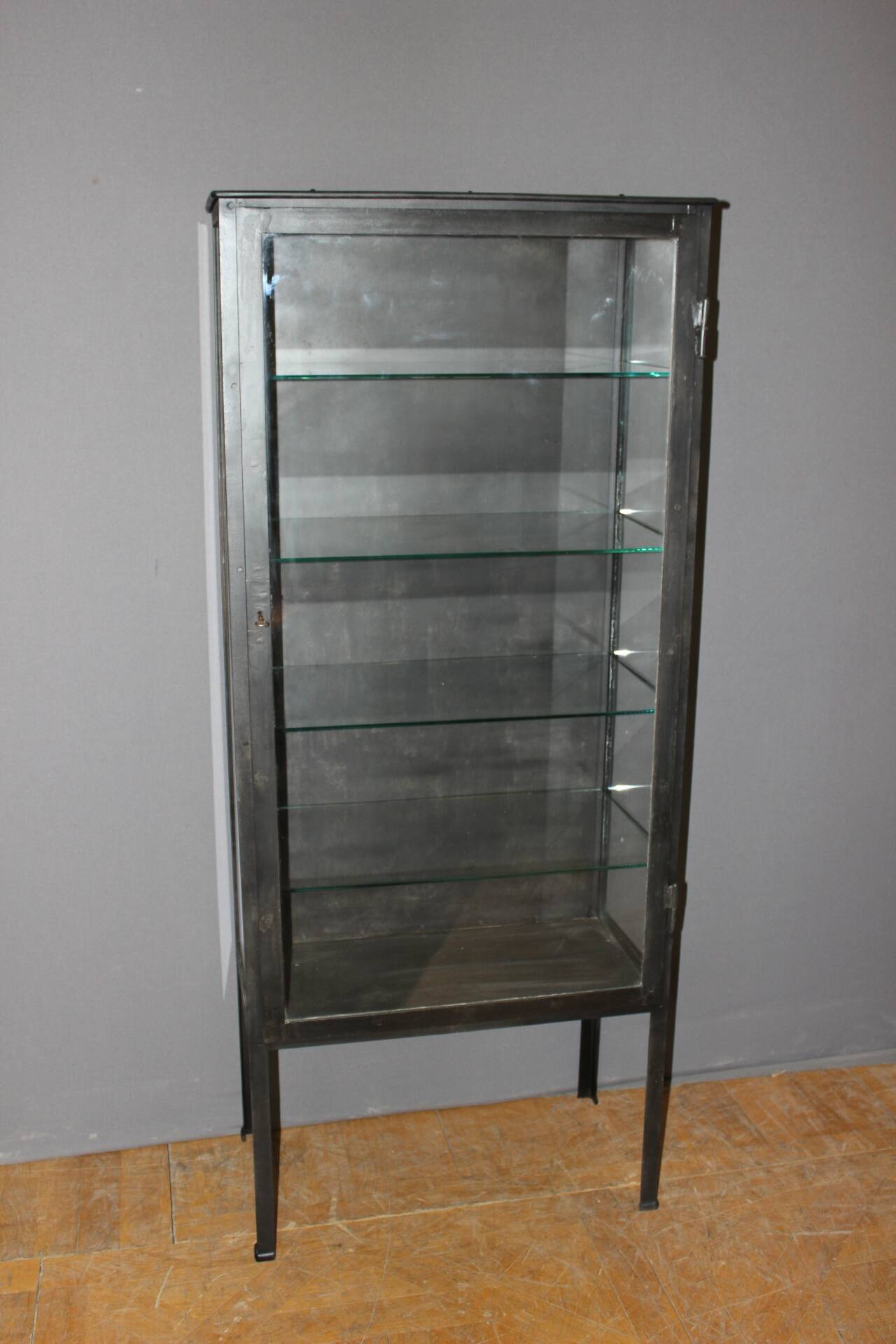 Iron display cabinet with black patina from around 1920