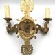 Antique bronze wall light with arm decorated with swans and palmettes in the Empire style