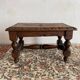 Low stool in carved wood