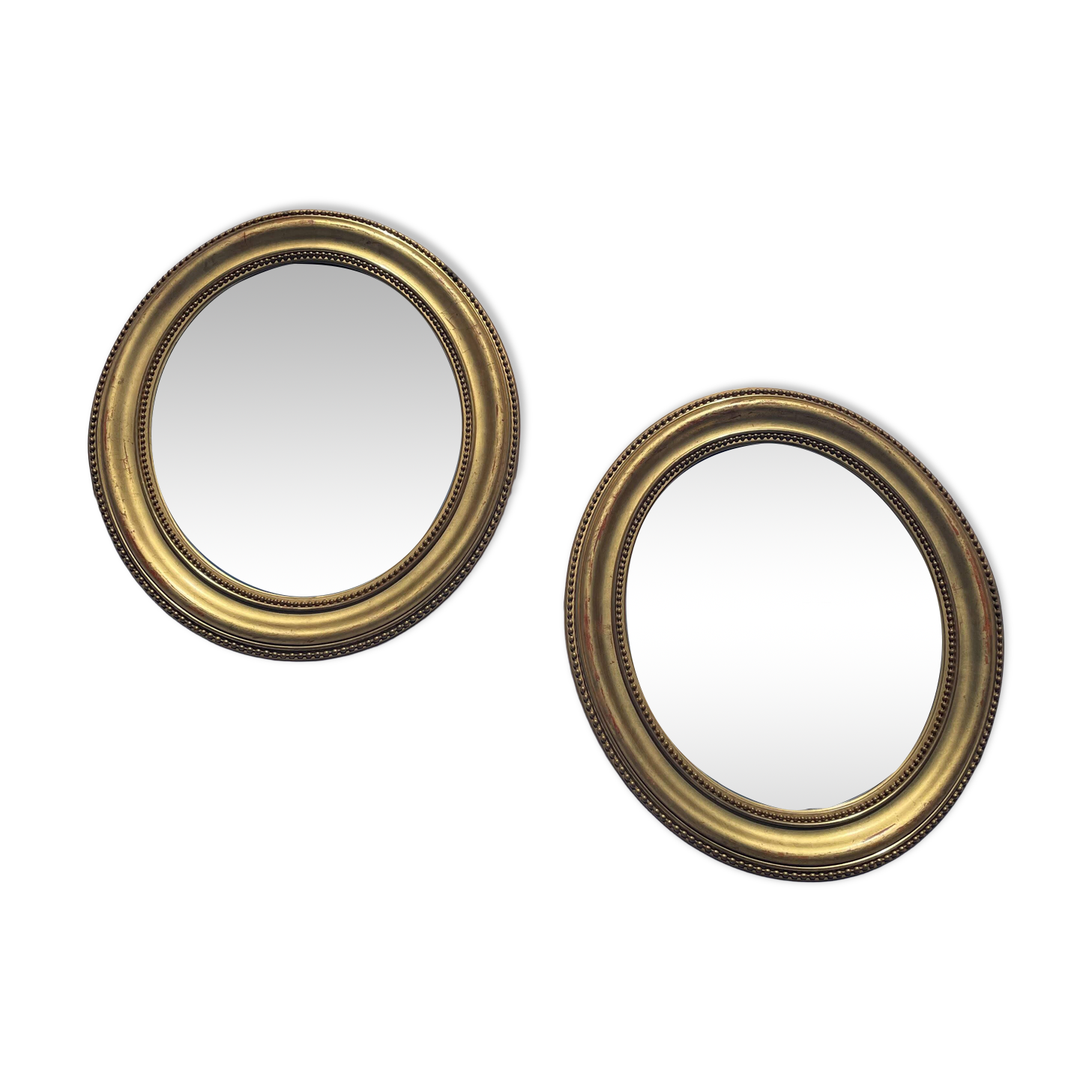 Duo de miroirs ovales et dorés en bois