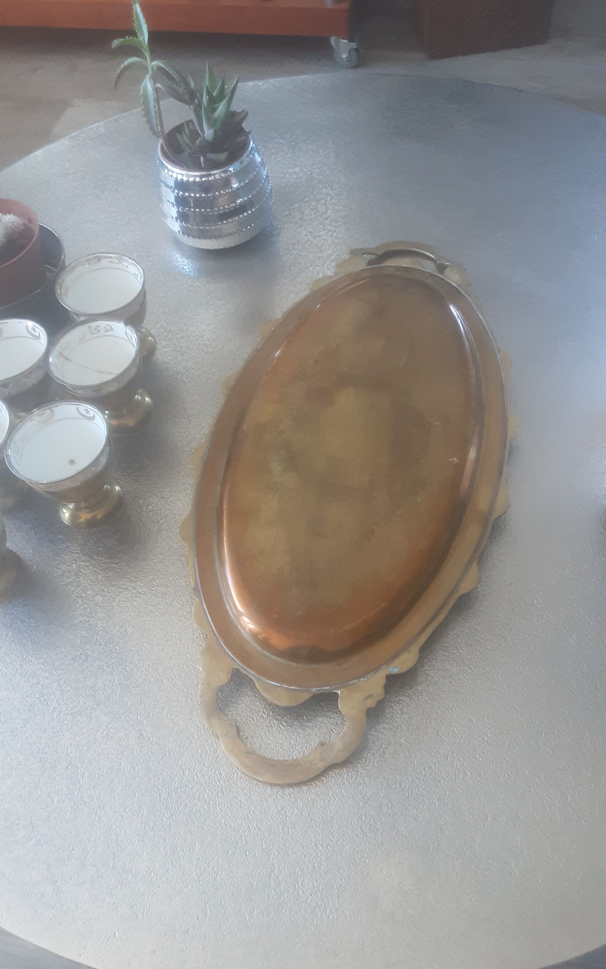 Old service porcelain brass cups