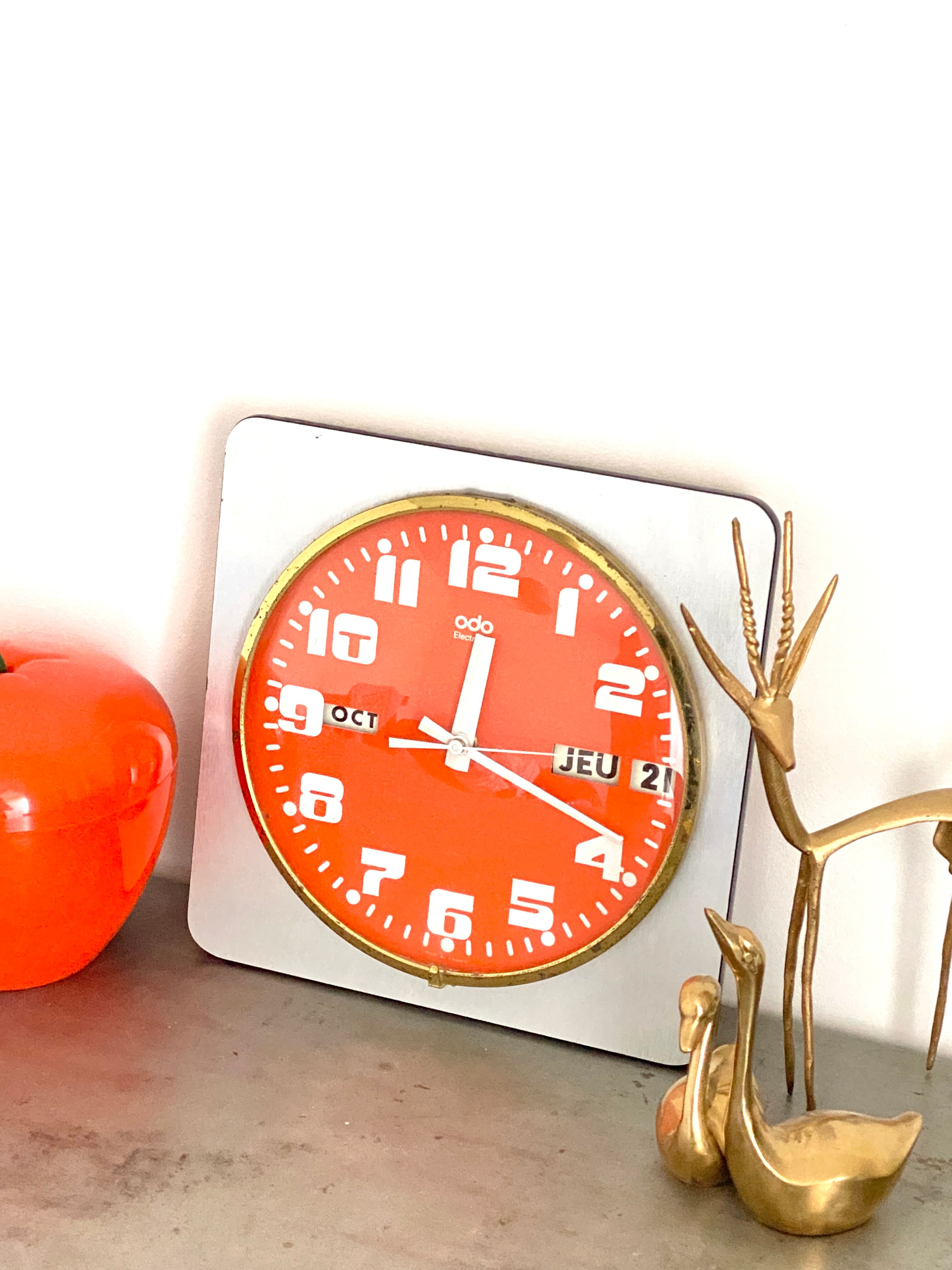 Vintage orange wall clock