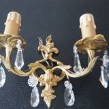 Pair of gilded bronze sconces and crystal pendants