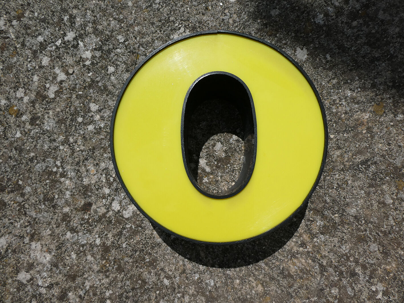 Yellow and black industrial sign "O" letter