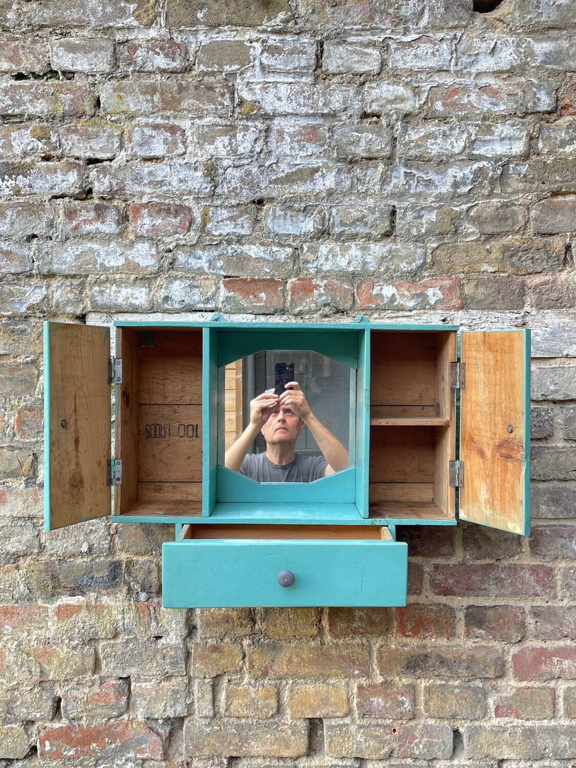 Old wall-mounted bathroom cabinet
