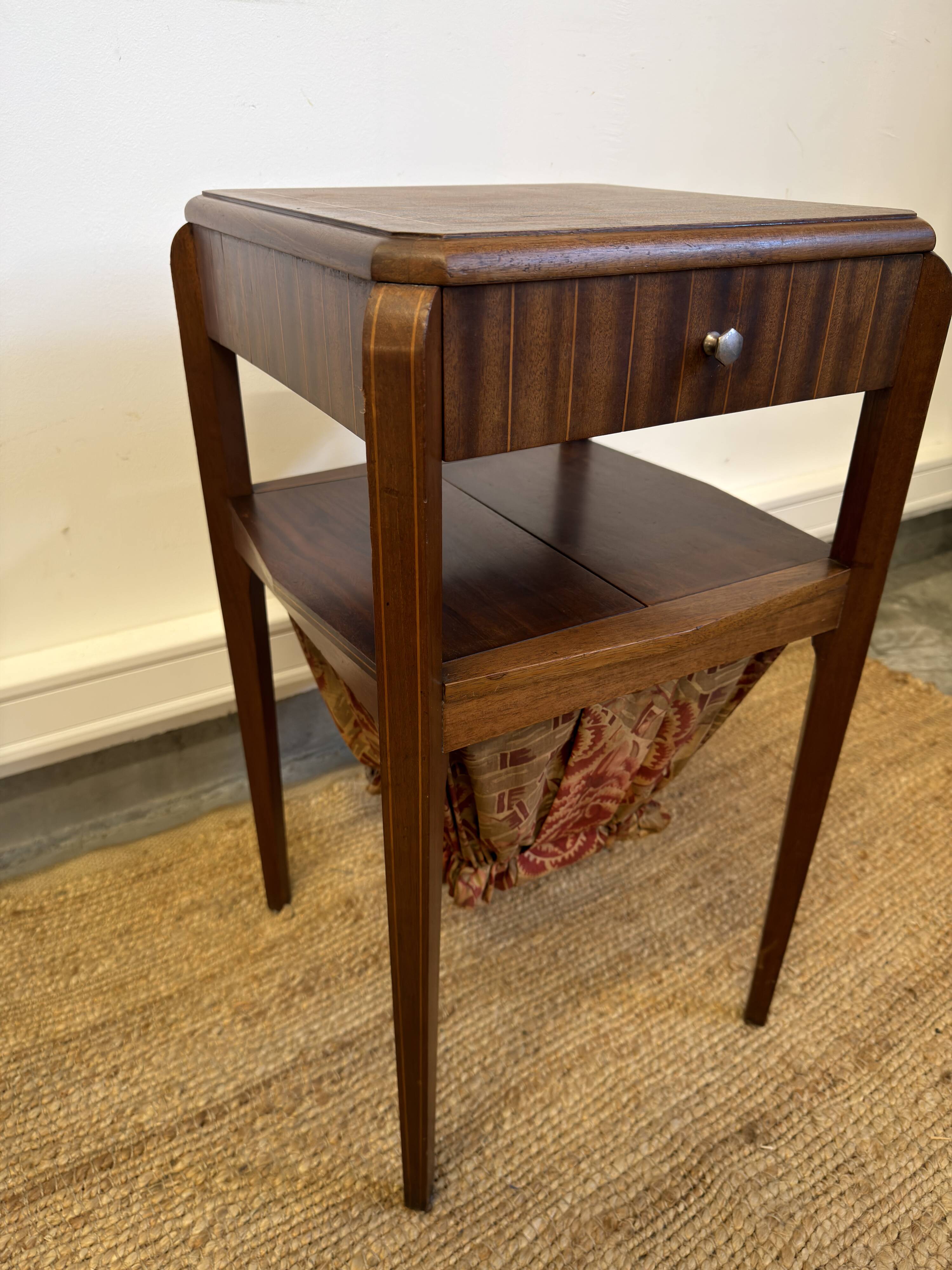 Art Deco sewing table in walnut with a foldable shelf.
