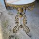 Round table in marble and gilded bronze