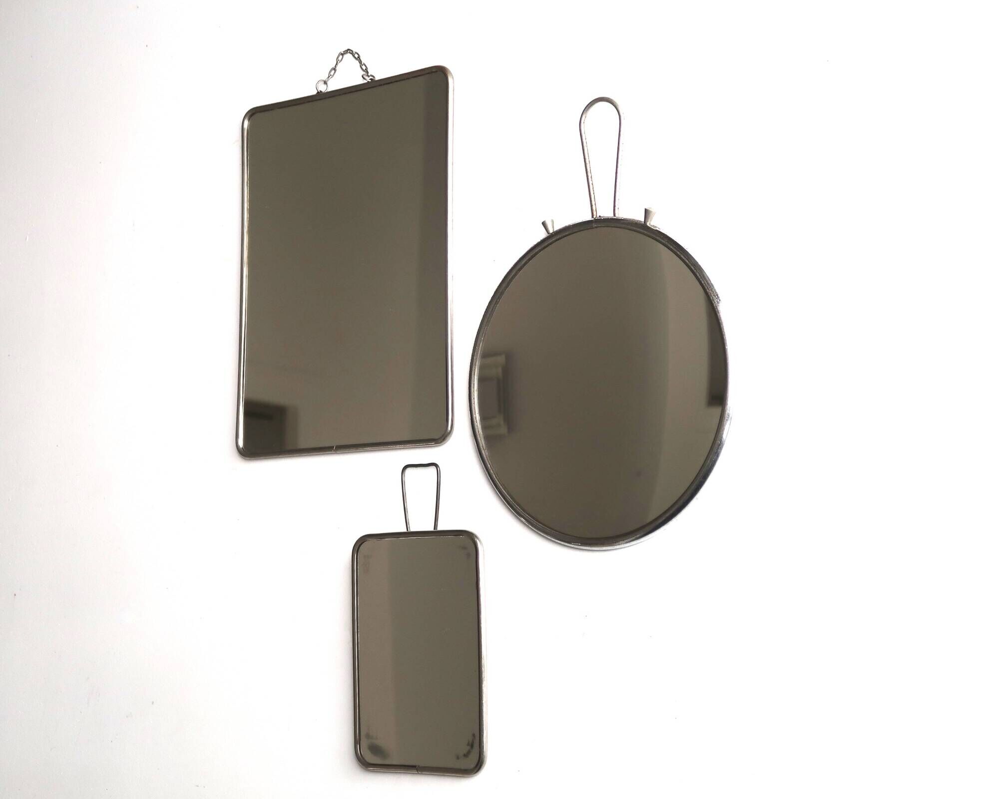Set of 3 rectangular and round magnifying barber mirrors, 1950s.
