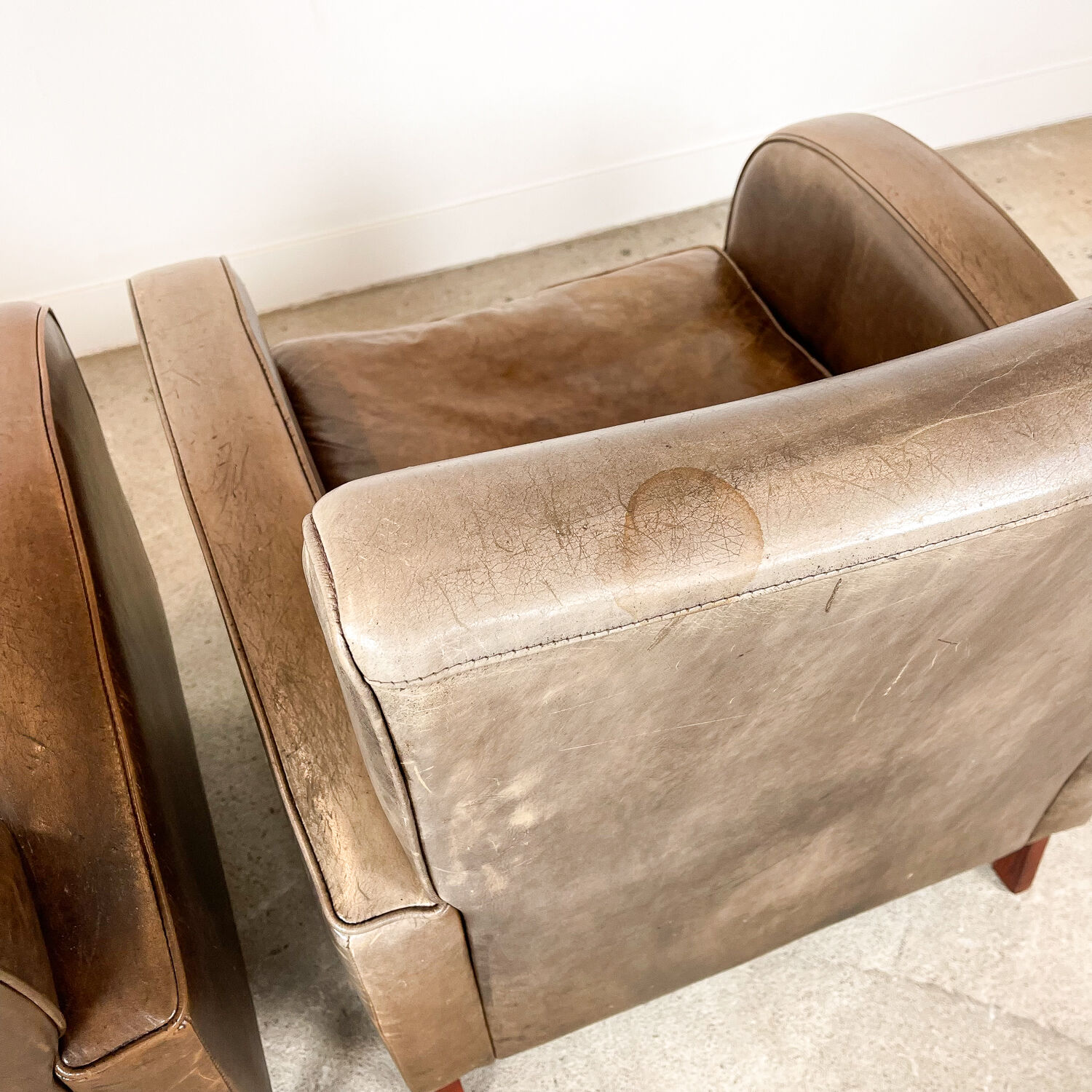 Set of two vintage leather wagon wheel armchairs Haarle