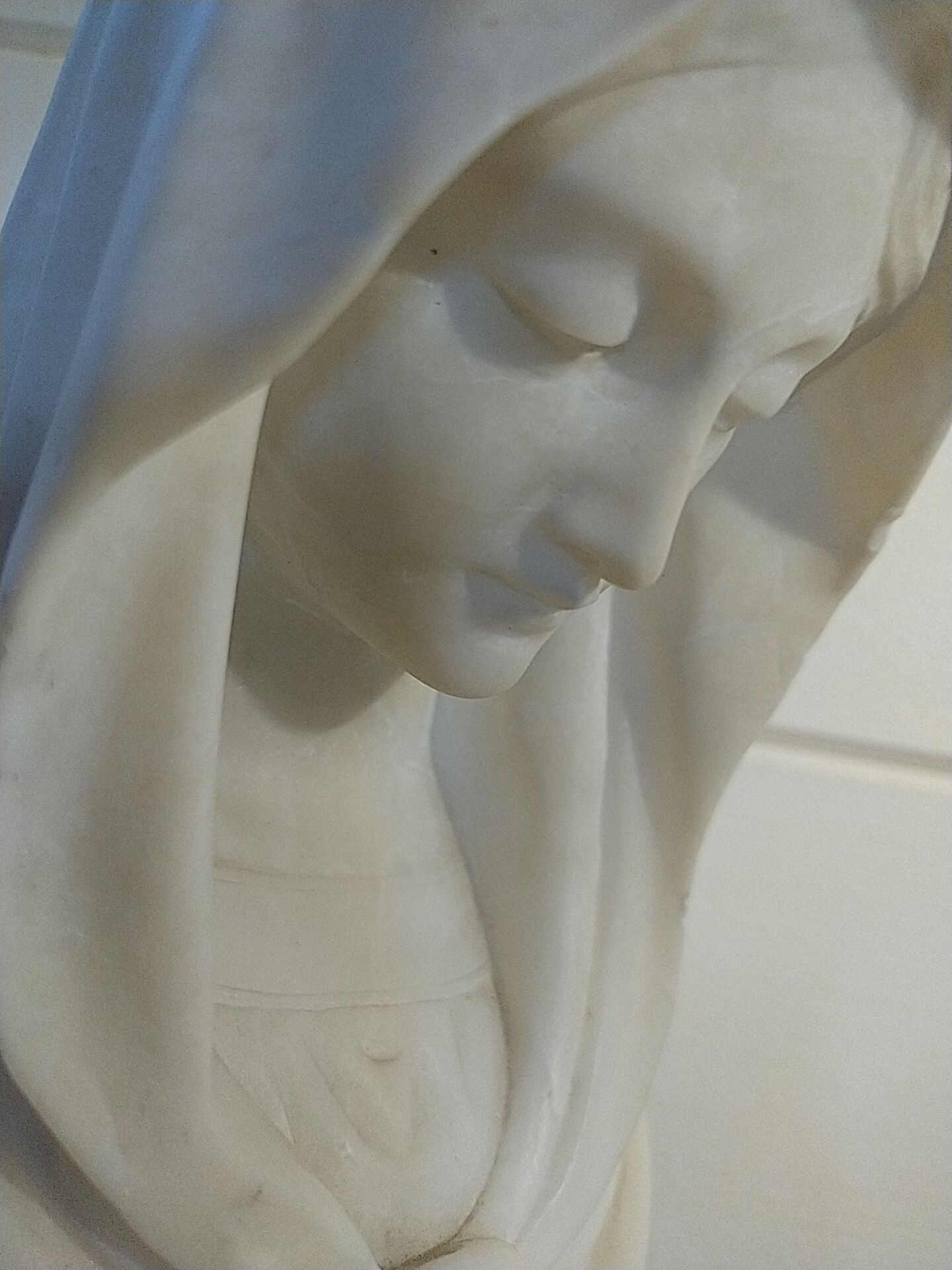Bust of the Virgin in alabaster by Guglielmo Pugi.