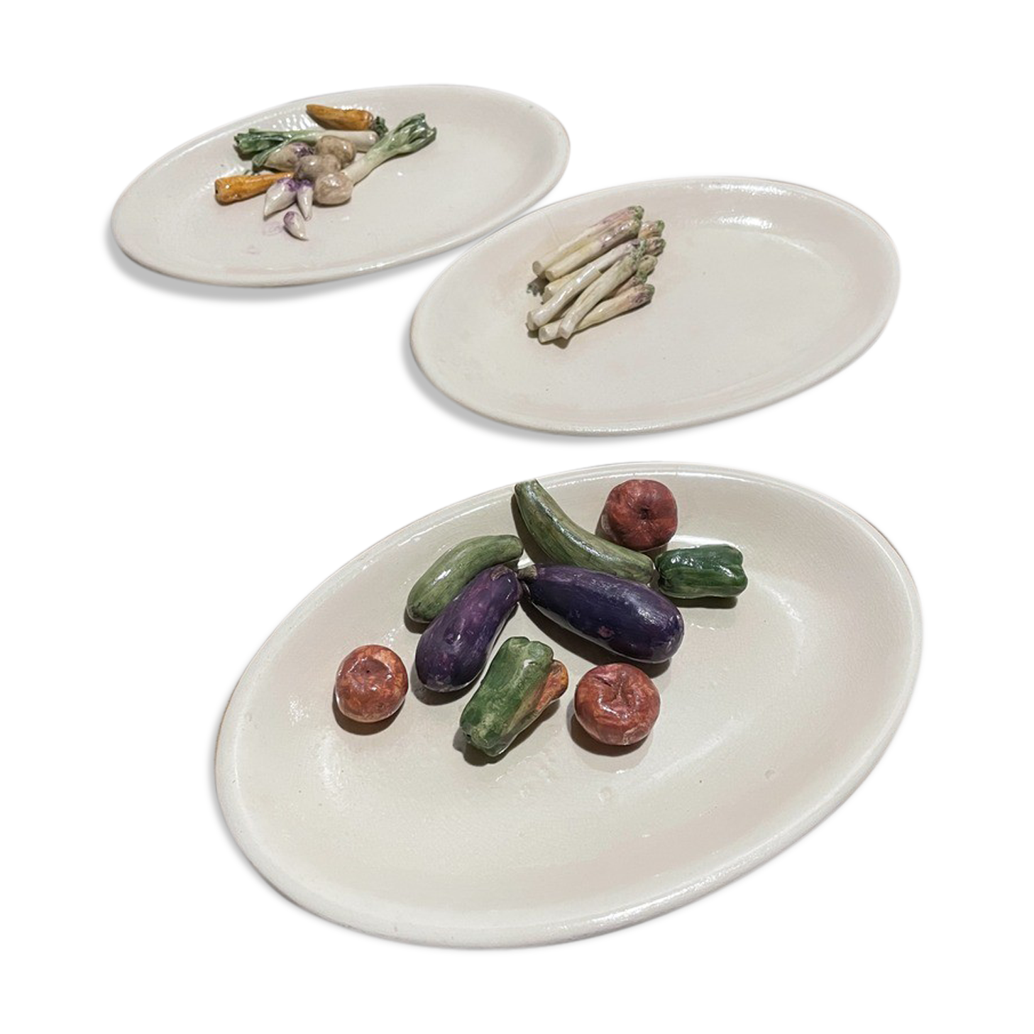3 plates decorated with vegetables