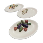 3 assiettes à décor de légumes en relief